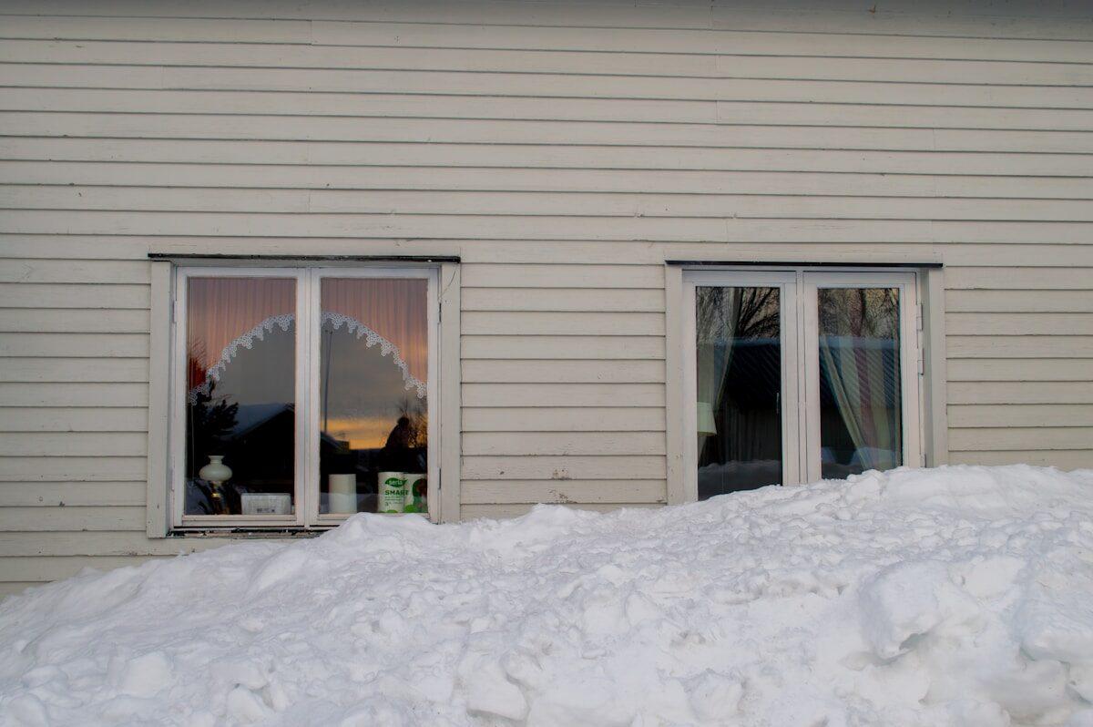 Snow-covered Idaho Falls home requiring winterization to prevent frozen and burst pipes